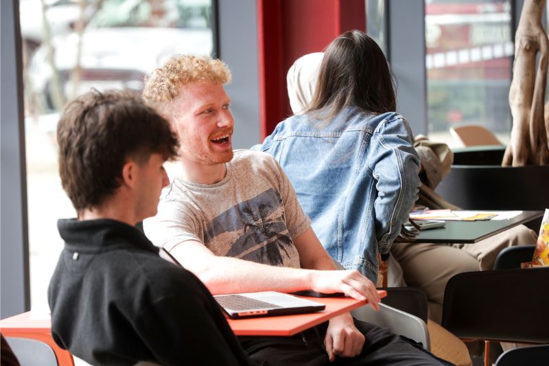 two male student chatting